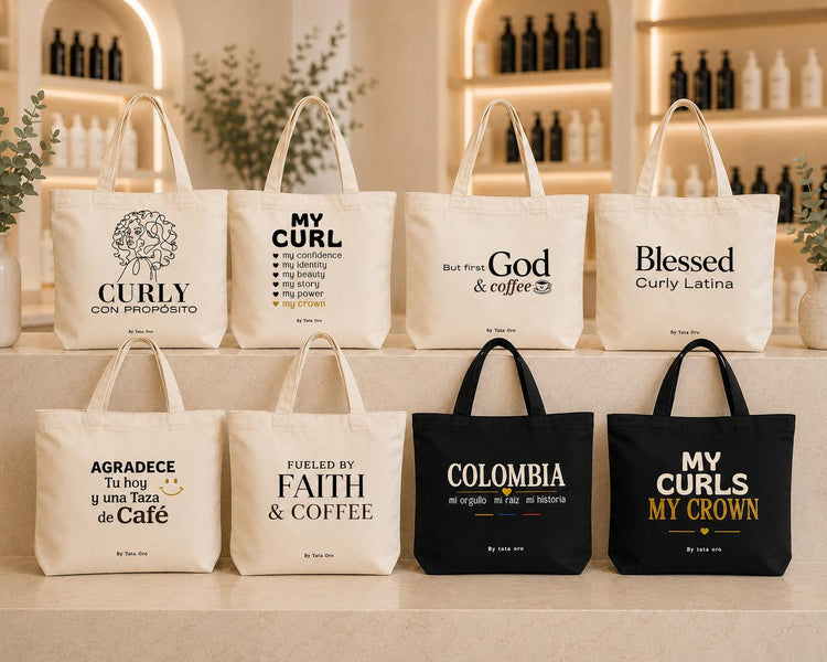 Tata Oro merchandise line — eight canvas tote bags displayed on salon shelves