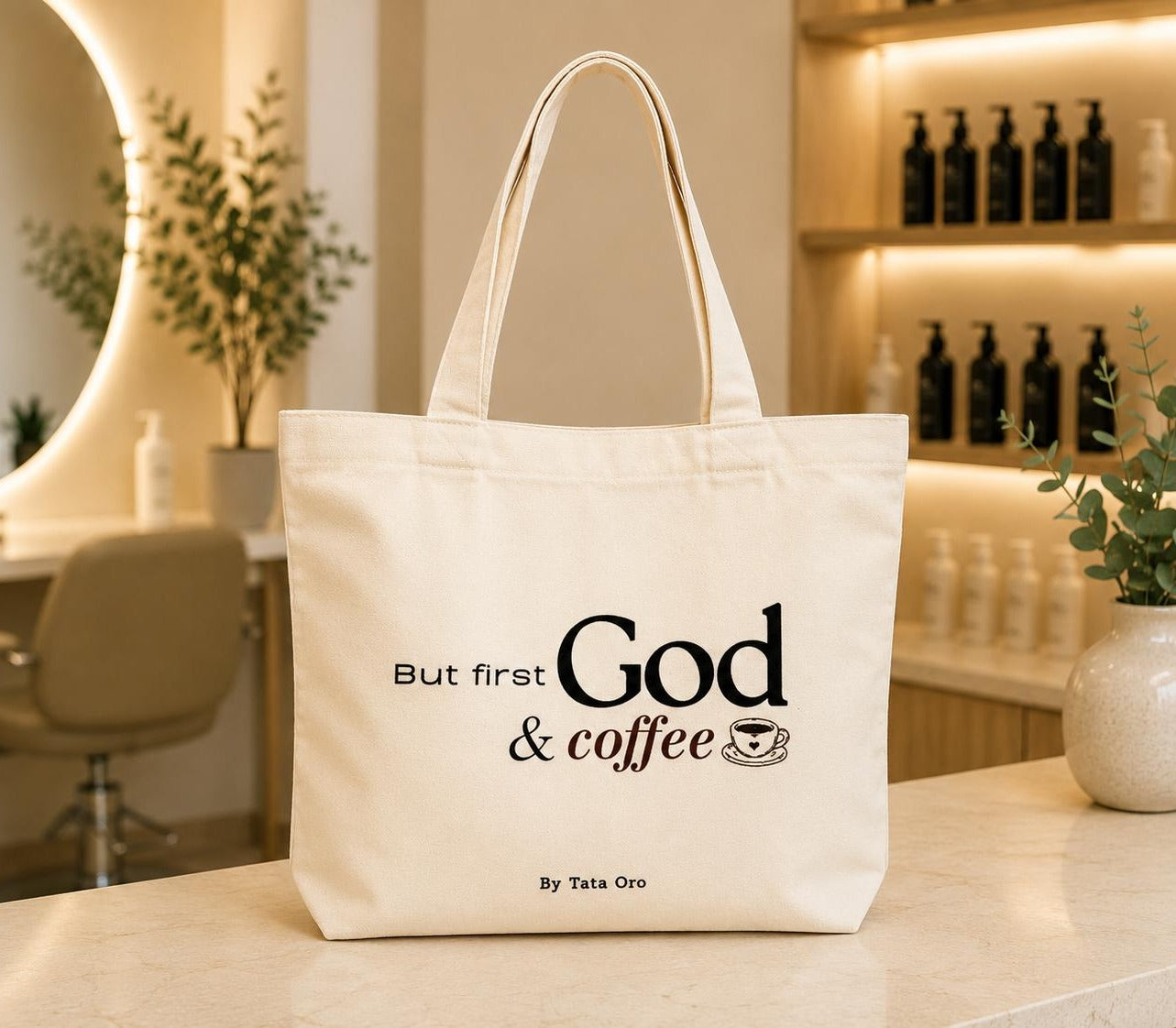 Natural canvas tote bag with But first God & coffee design and coffee cup illustration, by Tata Oro