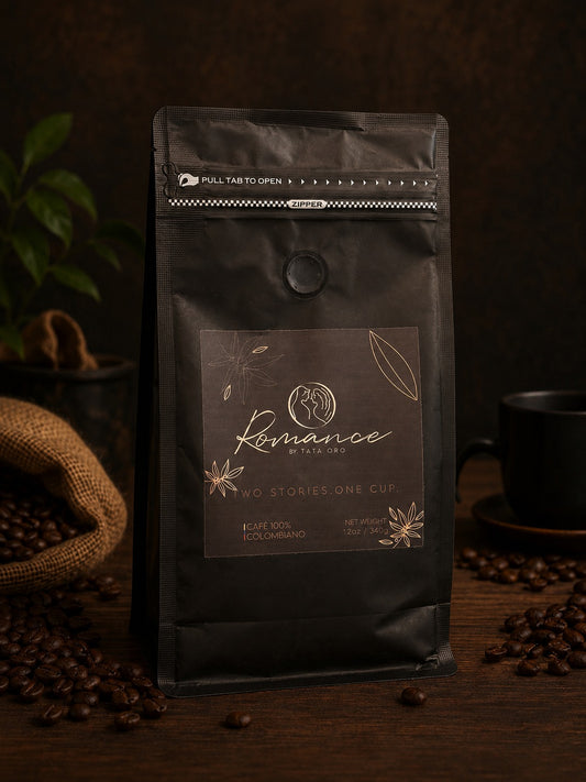 Romance by Tata Oro — matte black 12 oz coffee bag, front. Two Stories. One Cup. Café 100% Colombiano.